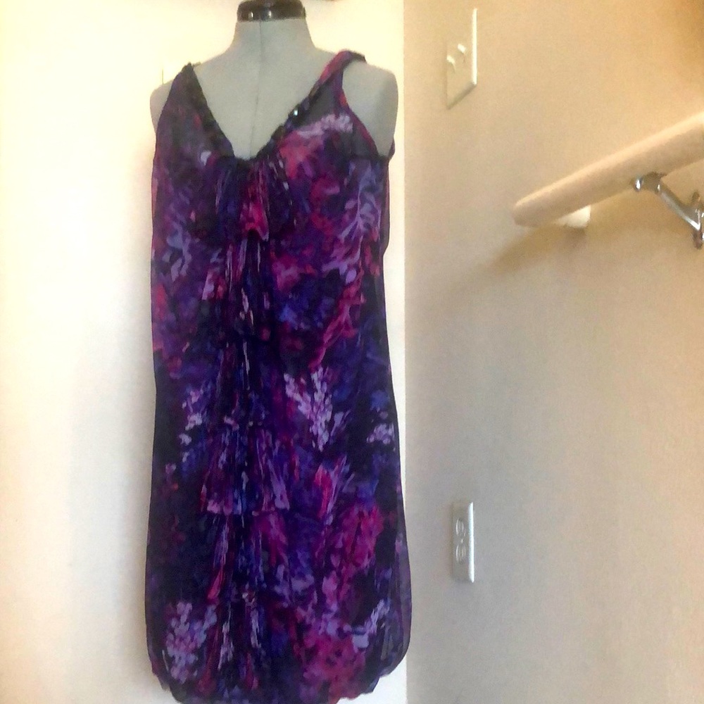 . Multi-colored floral print midi dress. Sleeveless, embellished neckline.